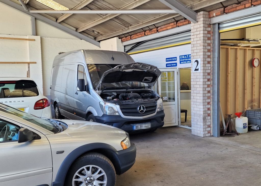 A Mercedes Sprinter van in for work